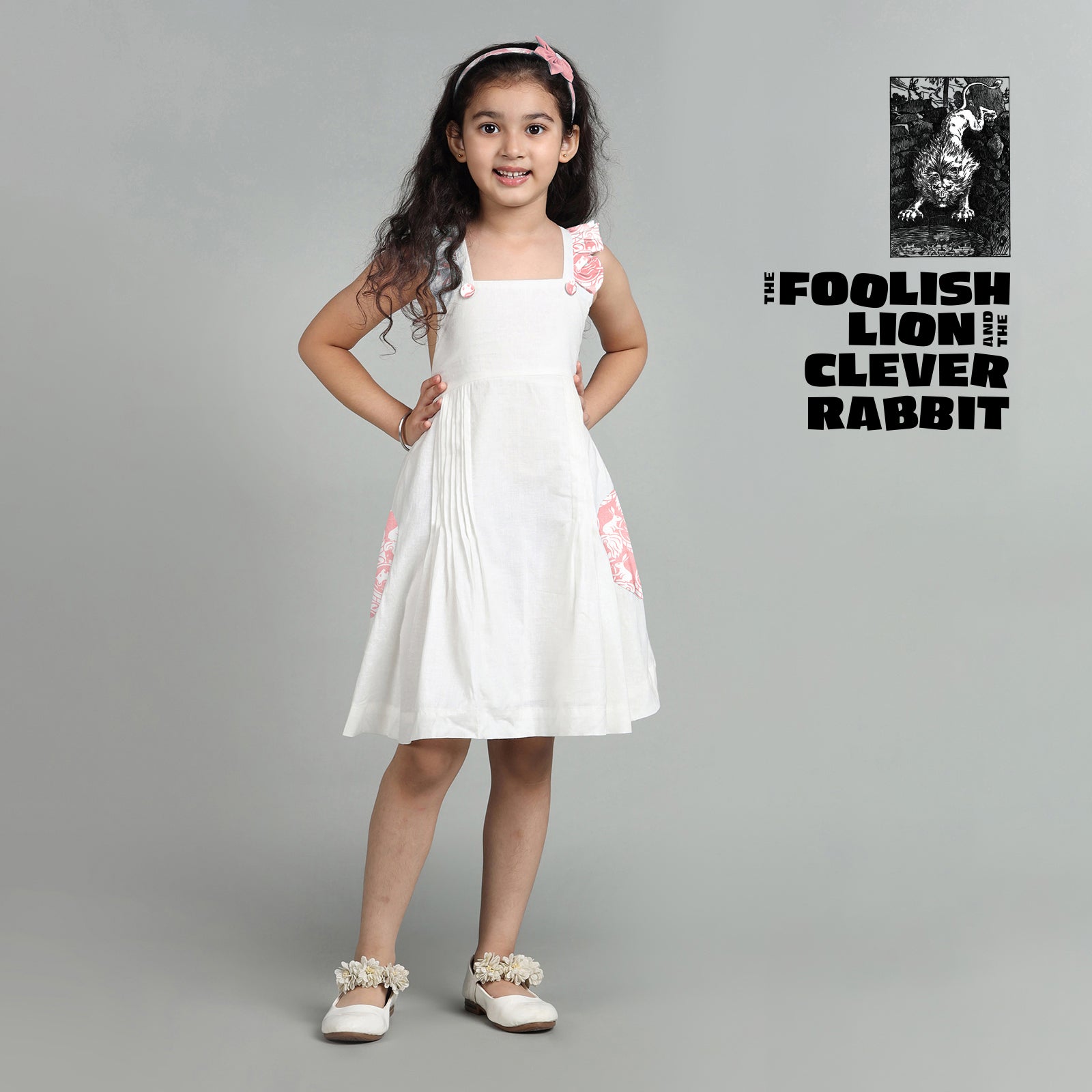 Cotton White Crisscross Back Frock For Girls with The Foolish Lion & The Clever Rabbit Print